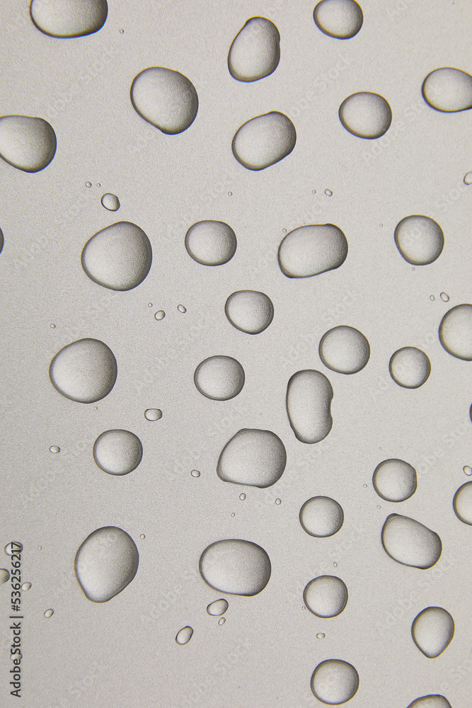 Abstract water drops on grey silver background, macro, Bubbles close up, Cosmetic liquid drops, Flat lay pattern.