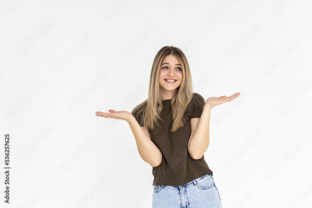 Photo of happy cheerful woman hold hands in balance compare products isolated on grey color background Photo of happy cheerful woman hold hands in balance compare products isolated on grey color background