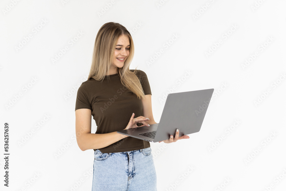 Portrait of a happy businesswoman working on laptop computer isolated over white background Portrait of a happy businesswoman working on laptop computer isolated over white background