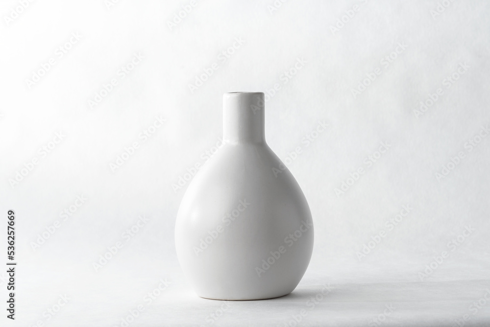Ceramic vase on a white background.	
