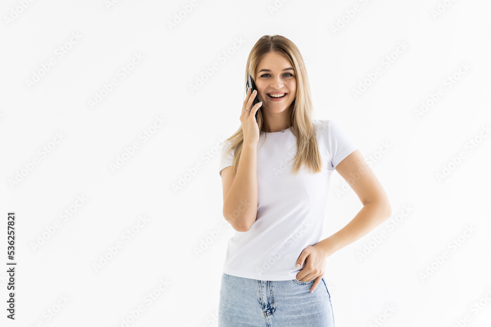 Young woman talking on cellphone, , over white background Young woman talking on cellphone, , over white background