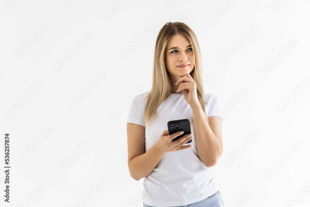 Portrait of happy woman using mobile phone, holding smarphone chatting with friends while sitting at home, scroll internet feed, use application, smile at display Portrait of happy woman using mobile phone, holding smarphone chatting with friends while sitting at home, scroll internet feed, use application, smile at display