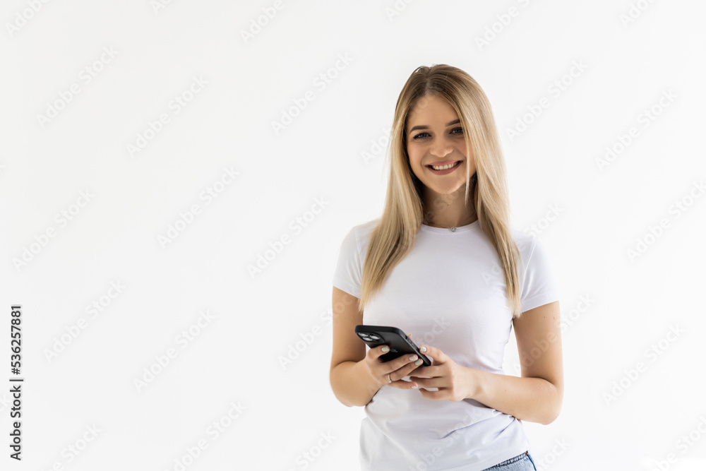 Portrait of happy woman using mobile phone, holding smarphone chatting with friends while sitting at home, scroll internet feed, use application, smile at display Portrait of happy woman using mobile phone, holding smarphone chatting with friends while sitting at home, scroll internet feed, use application, smile at display