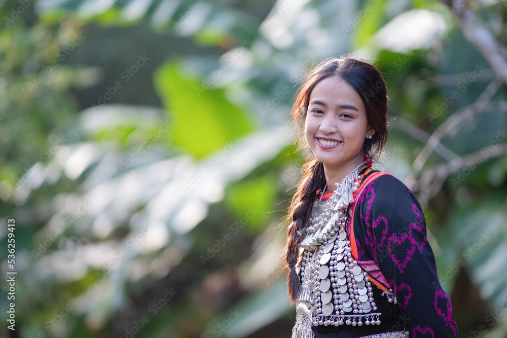 Asia woman with traditional clothes and silver accessories in Lisu hill tribe minority village. Asia woman with traditional clothes and silver accessories in Lisu hill tribe minority village.