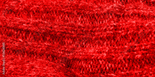 The texture of the red color of the fabric. Closeup