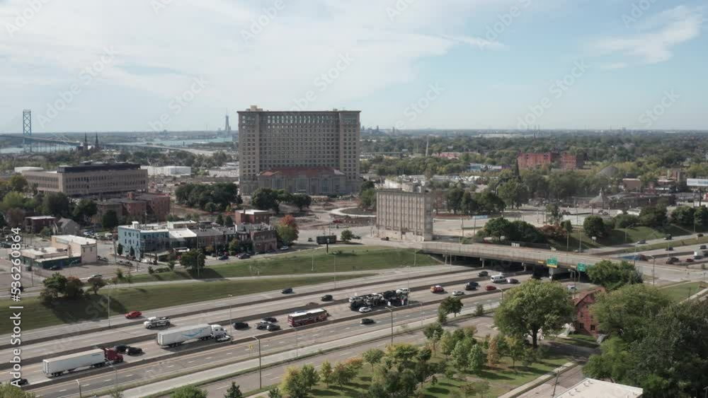 Wide shot of drone video showing Michigan Central Station in Detroit, Michigan with highway traffic. Wide shot of drone video showing Michigan Central Station in Detroit, Michigan with highway traffic.