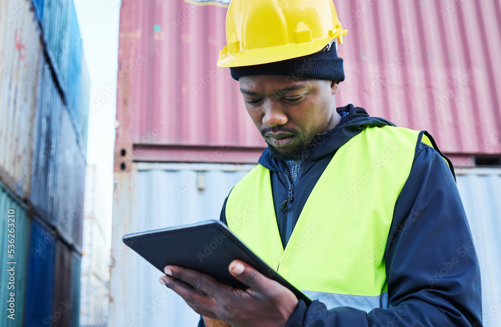 Digital tablet, logistics and black manager working on outdoor cargo freight site with shipping containers. African industrial man employee planning delivery, shipping and supply chain on mobile. Digital tablet, logistics and black manager working on outdoor cargo freight site with shipping containers. African industrial man employee planning delivery, shipping and supply chain on mobile.