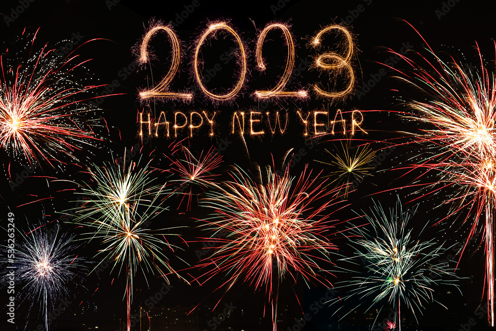 Happy New Year 2023. Sparkling burning text Happy New Year 2023 isolated on black background. Beautiful Glowing golden overlay object for design holiday greeting card Happy New Year 2023. Sparkling burning text Happy New Year 2023 isolated on black background. Beautiful Glowing golden overlay object for design holiday greeting card
