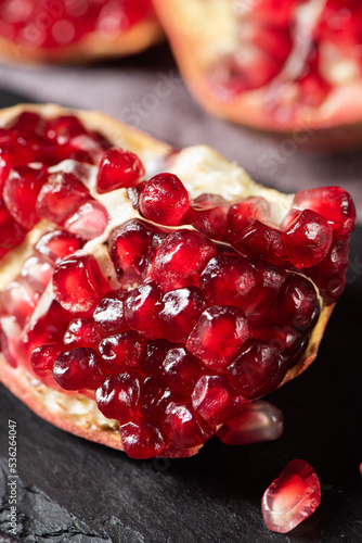 ripe red pomegranate fruit on table
