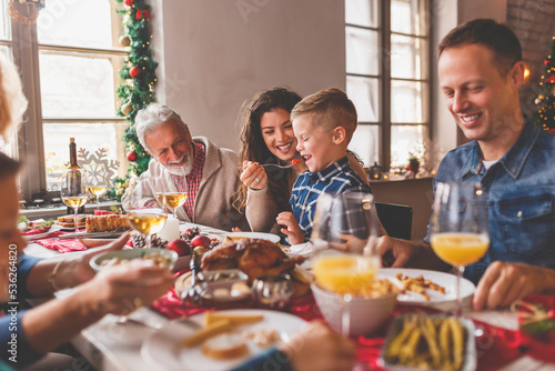Family gathered around the table for Christmas dinner