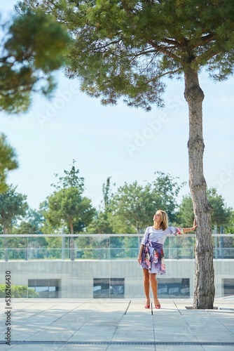 A fashionable girl in a stylish lilac dress