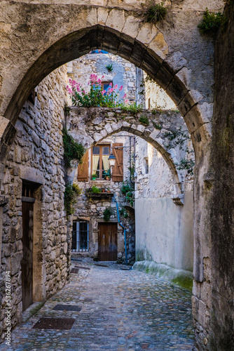 View on the narrow medieval street of Viviers old town in the South of France  Ardeche 