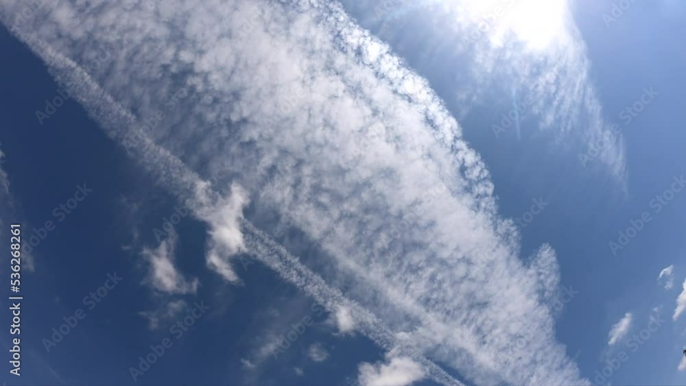 Time-lapse with the movement of clouds across the sky. In the frame you can see traces of flying planes Time-lapse with the movement of clouds across the sky. In the frame you can see traces of flying planes