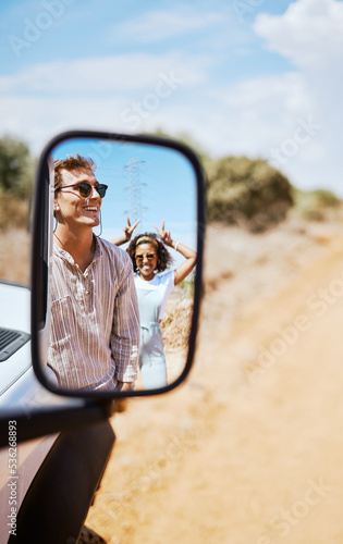 Obraz na płótnie Couple on road trip, smile in car mirror reflection and happy smile with love on desert holiday road trip drive in South Africa