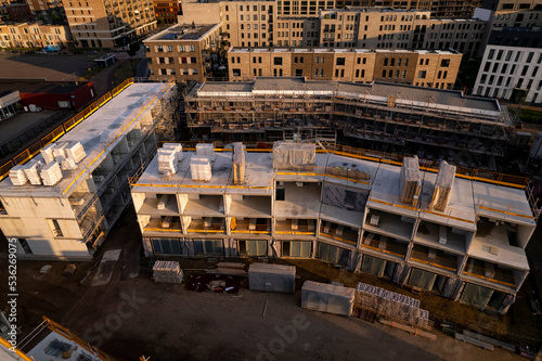 Aerial view of real estate project PUUR21 housing construction site part of urban development plan in initial building phase at sunset. Engineering architecture © Maarten Zeehandelaar