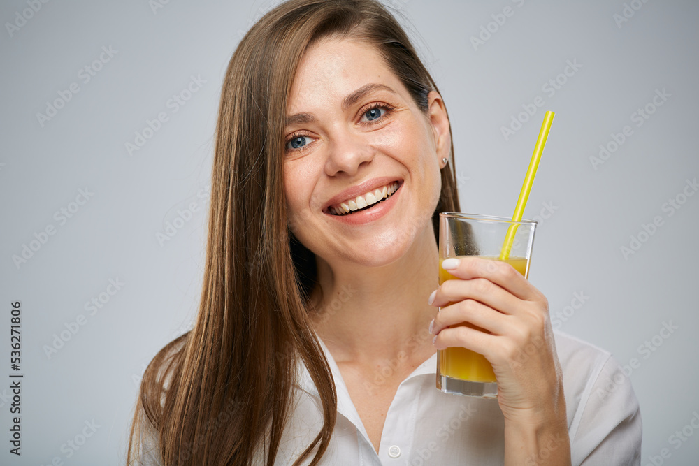 Close up face smiling woman with orange juice glass. Isolated female advertising portrait. Close up face smiling woman with orange juice glass. Isolated female advertising portrait.