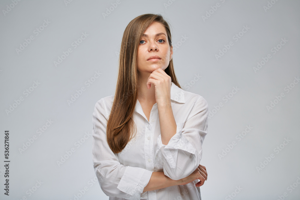 Serious woman in white shirt. Isolated female portrait. Serious woman in white shirt. Isolated female portrait.