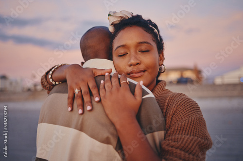 Love, peace and calm black couple hug while relax on outdoor date for freedom, bonding and enjoy quality time together. Romance, vacation and young gen z man and woman on romantic holiday in Jamaica #536273294