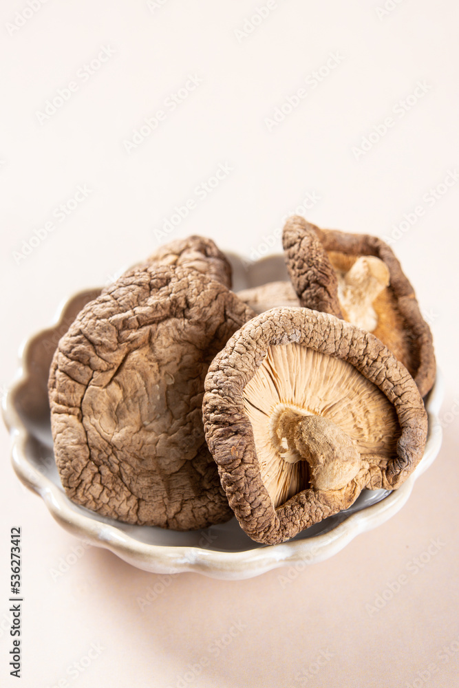Jamur Shitake Kering or Dry Shitake Mushroom also known as hioko mushroom. Lentinula edodes. Jamur Shitake Kering or Dry Shitake Mushroom also known as hioko mushroom. Lentinula edodes.