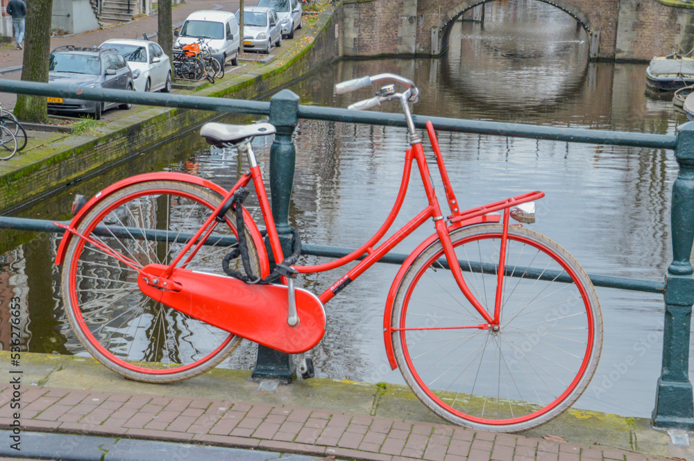 Bicycle On A Canal At Amsterdam The Netherlands