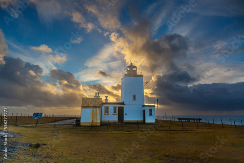 Sunset behind Eshaness Lighthouse Shetland