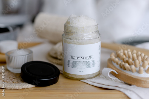 White sugar body scrub. Cosmetics for rejuvenation. photo