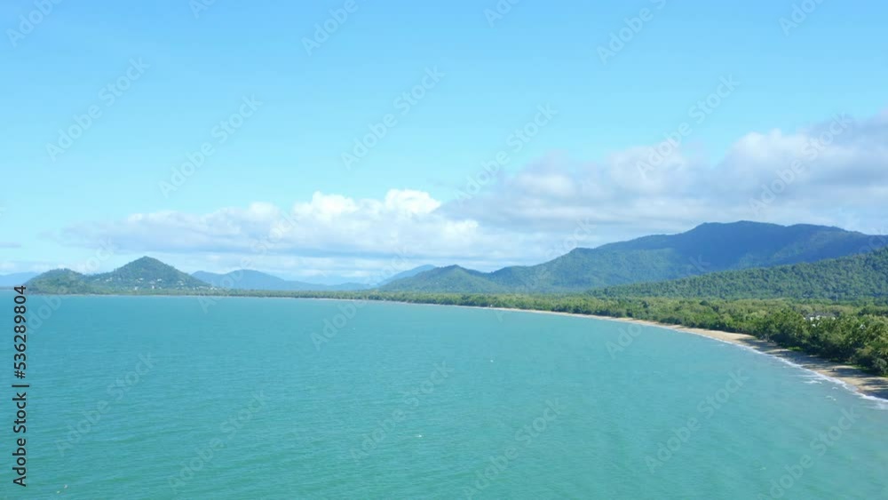 Aerial 4K Drone View Of North Queensland Cairns Beach With Rainforest Meeting Sand And Ocean, Australia Aerial 4K Drone View Of North Queensland Cairns Beach With Rainforest Meeting Sand And Ocean, Australia