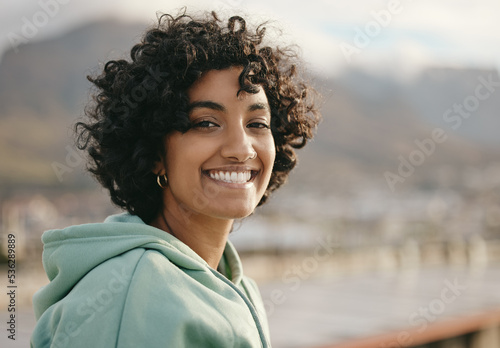 Tablou canvas Portrait, face and indian woman on a rooftop, relax and happy while enjoying sunrise and city views