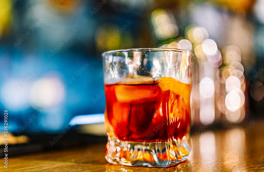 Cocktail Negroni with gin, campari martini rosso and orange. negroni cocktail at the bar Cocktail Negroni with gin, campari martini rosso and orange. negroni cocktail at the bar
