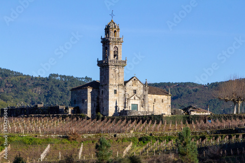 Iglesia de Santa Maria de Beade (siglo XVI), rodeada de viñedos. Ribeiro, Galicia, España. photo