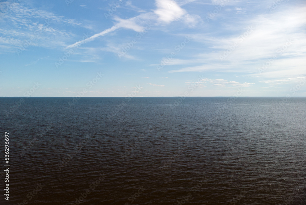 The horizon of the Gulf of Finland in summer. The horizon line on the water.