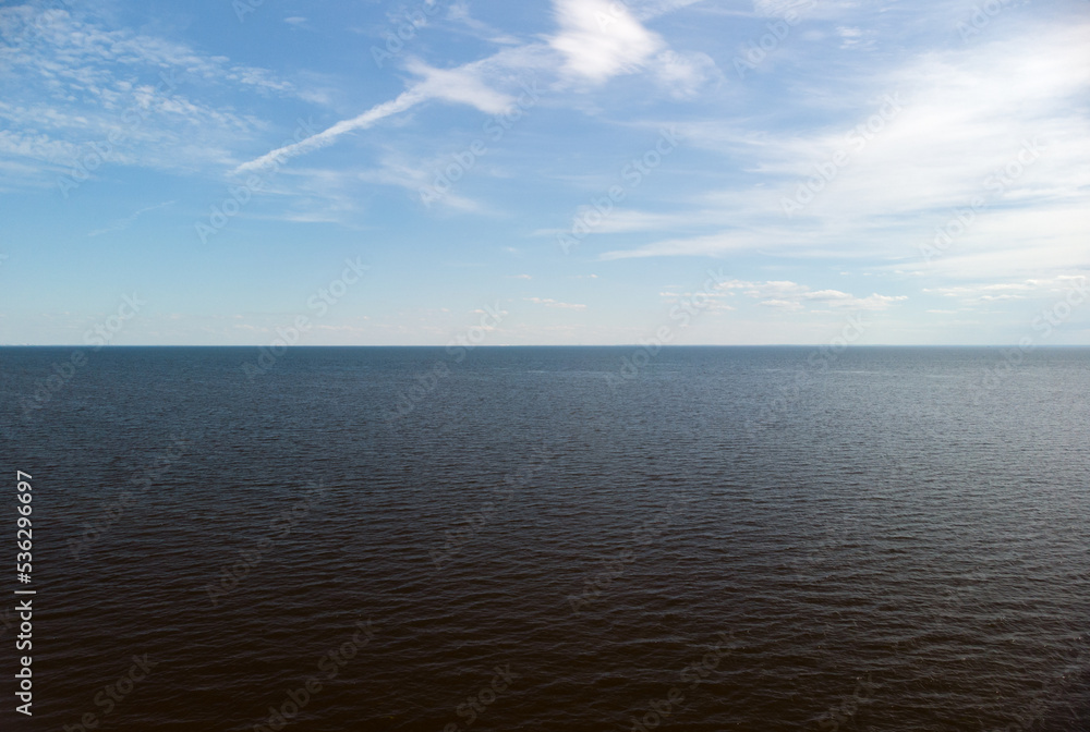 The horizon of the Gulf of Finland in summer. The horizon line on the water. The horizon of the Gulf of Finland in summer. The horizon line on the water.