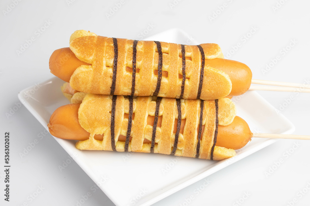 Breakfast sausage wrapped pancakes in a plate Breakfast sausage wrapped pancakes in a plate