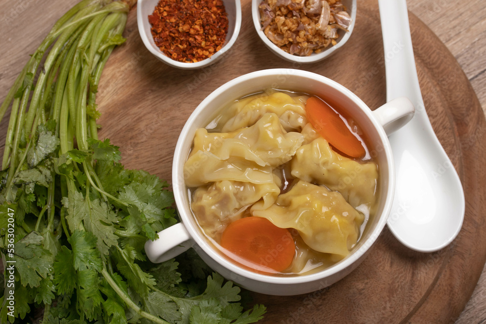 Shrimp dumplings in clear broth and dumplings on table, Chinese wonton dumpling Shrimp dumplings in clear broth and dumplings on table, Chinese wonton dumpling