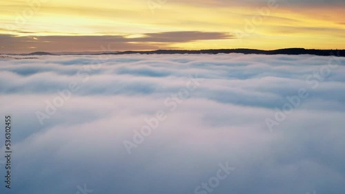 Germany, Remstal valley, drone shot of a flight over a rural landscape over clouds in autumn in sunrise photo