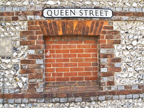 Street name Queen Street on wall