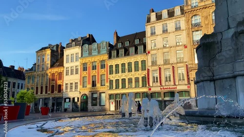 Water Fountain Of The Colonne de la Deesse At Grand Place With Striking Architectures In The Background In Lille, France. - wide photo