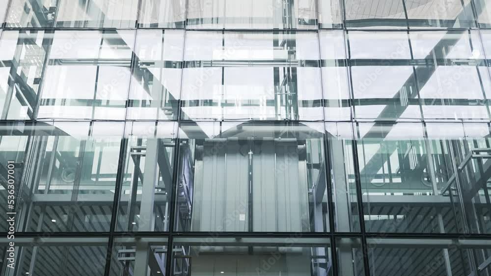 sightseeing elevator of modern archtecture with glass wall sightseeing elevator of modern archtecture with glass wall
