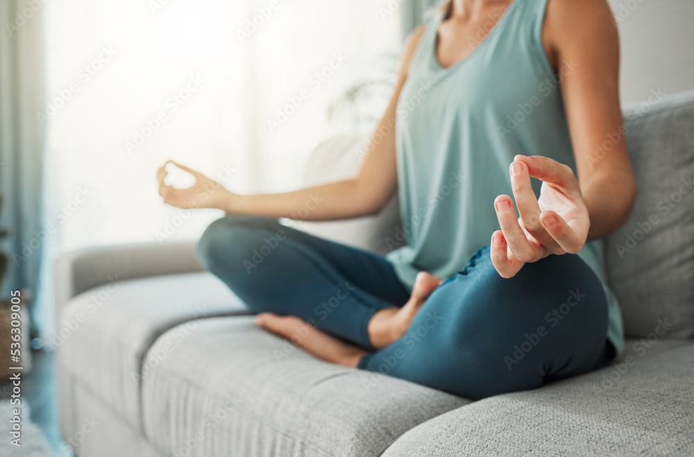 Meditation, yoga peace and hands of woman working on spiritual wellness on living room sofa in her house. Calm person with lotus zen pose for faith, mind health in the morning on the couch