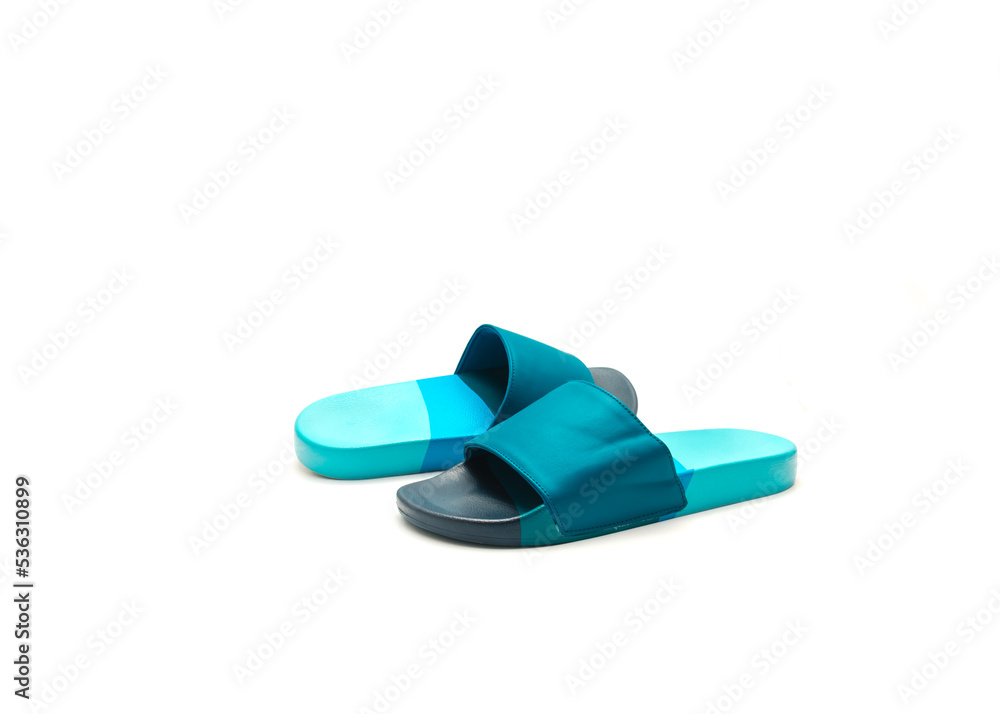 Brand new a pair of blue slide sandals for men with faux-leather upper, comfortable foam lining and contoured foot bed isolated on white background Brand new a pair of blue slide sandals for men with faux-leather upper, comfortable foam lining and contoured foot bed isolated on white background