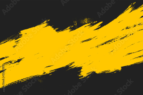 Yellow grunge brush streaks painting on black background