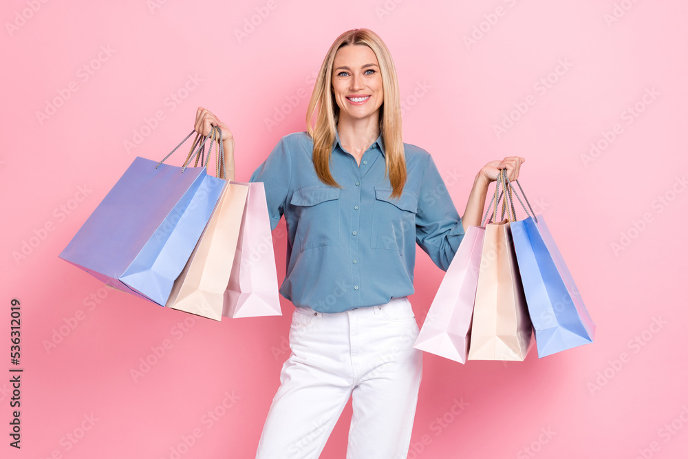 Photo of young positive pretty nice woman wear stylish smart casual outfit just from black friday sale shopping offer positive isolated on pink color background