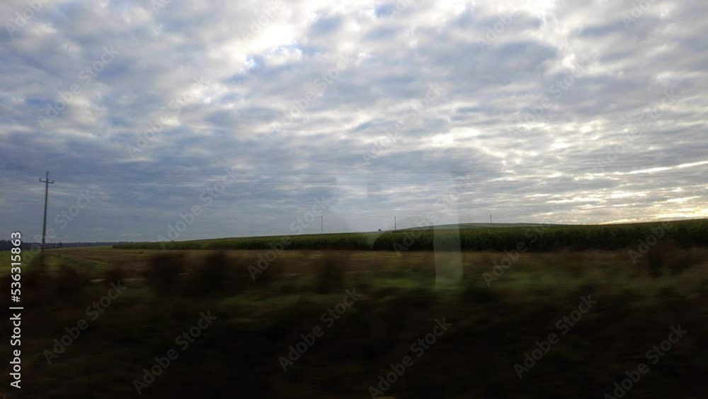 Tranquil Nature With Cloudscape On The Horizon View From A Window Train Traveling From Warsaw To Krakow, Poland. POV