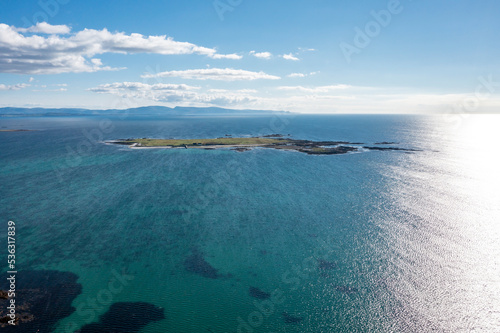 Aerial view of Inishkeeragh island seen from Clouhhcorr beach on Arranmore Island in County Donegal, Republic of Ireland