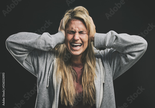 Canvas Print Stress, screaming or crying woman with hands over ears on black background in studio with mental health, anxiety or schizophrenia