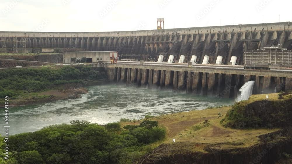 Slow Motion Of Water Bursting Through Spillway At Itaipu Dam On Parana River In Brazil. wide