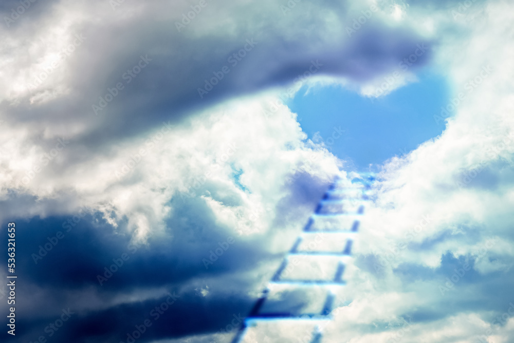 The ladder leads to the heart.Dramatic Blue sky white clouds,heart shaped clouds with space for text background.