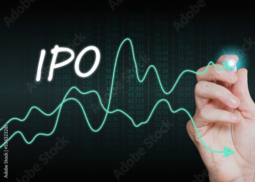 ipo text with financial growth graph and hand pointing on the the dark background, trading, investment and business concept photo
