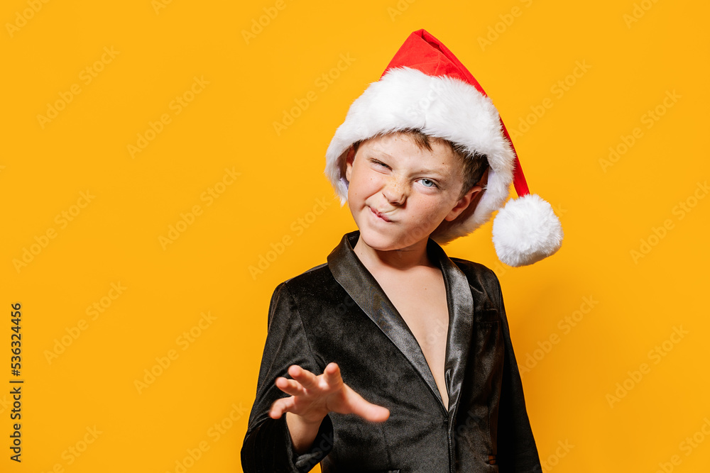Boy in Santa hat making face