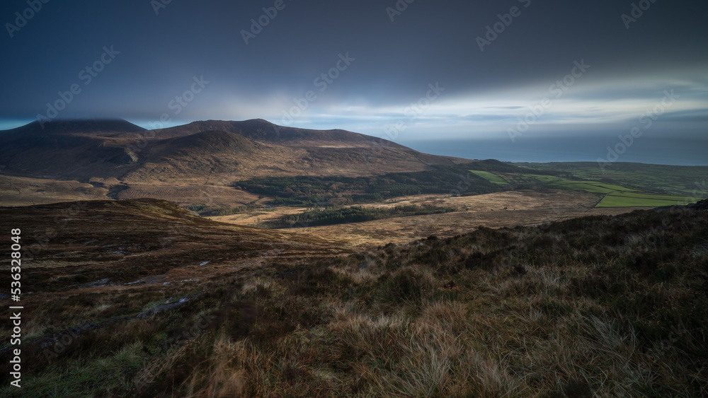 Mourne mountains valley with storm clouds in winter, Northern Ireland